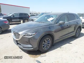 2021 Mazda CX-9 Touring with VIN JM3TCACY2M0502016, listed as a IAAI auction lot 41825456 with 86,068 mi miles and . Bid and sale history available at carsss.com. Image 2.