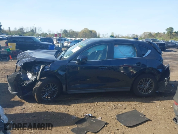 2019 Mazda CX-5 Touring with VIN JM3KFBCM6K0513037, listed as a IAAI auction lot 42121789 with 59,455 mi miles and . Bid and sale history available at DreamBid. Image 14.