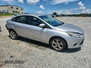 2013 Ford Focus SE with VIN 1FADP3F22DL323418, listed as a Copart auction lot 61859225 with 62,415 mi miles and Salvage title. Bid and sale history available at DreamBid. Image 4.