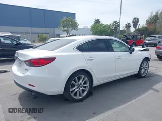 2016 Mazda Mazda6 i Touring with VIN JM1GJ1V57G1429887, listed as a IAAI auction lot 42029170 with 140,519 mi miles. Bid and sale history available at carsss.com. Image 4.