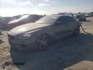 2015 BMW M6 z VIN WBS6C9C52FD467461, wystawiony jako Copart lot #68057084 z przebiegiem 130 687 mil mil oraz Szkody całkowita. Historia ofert i sprzedaży dostępna na DreamBid. Obrazek 1.