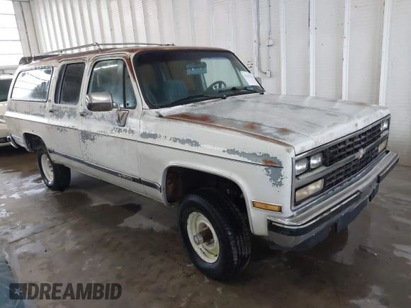 1989 Chevrolet Suburban z VIN 1GNEV16K2KF127586, wystawiony jako IAAI lot #41867659 z przebiegiem 71 373 mil mil oraz . Historia ofert i sprzedaży dostępna na DreamBid. Obrazek 1.