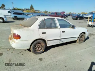 1997 Hyundai Accent z VIN KMHVF24NXVU373676, wystawiony jako Copart lot #77866484 z przebiegiem 151 949 mil mil oraz Tytuł czysty. Historia ofert i sprzedaży dostępna na DreamBid. Obrazek 3.