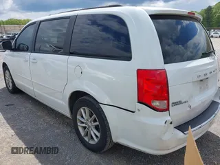 2014 Dodge Grand Caravan SXT with VIN 2C4RDGCG8ER264027, listed as a IAAI auction lot 42018350 with 311,876 mi miles and . Bid and sale history available at DreamBid. Image 3.