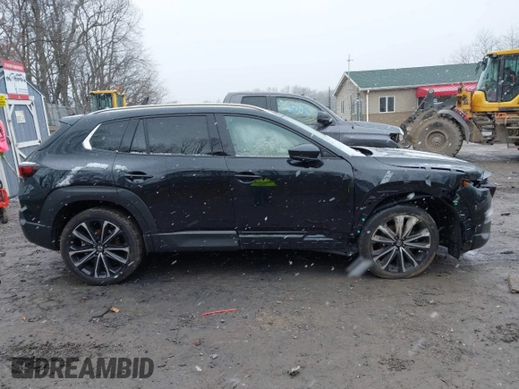2024 Mazda CX-50 Premium z VIN 7MMVABDYXRN180263, wystawiony jako IAAI lot #41738791 z przebiegiem 9 688 mil mil oraz . Historia ofert i sprzedaży dostępna na DreamBid. Obrazek 13.