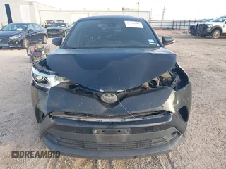 2018 Toyota C-HR XLE with VIN JTNKHMBX6J1007058, listed as a IAAI auction lot 42100587 with 71,725 mi miles and . Bid and sale history available at DreamBid. Image 13.