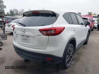 2016 Mazda CX-5 Grand Touring with VIN JM3KE4DY7G0737232, listed as a IAAI auction lot 42158279 with Not Provided miles and . Bid and sale history available at DreamBid. Image 4.