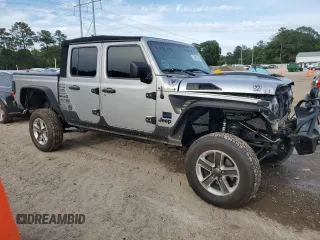 2020 Jeep Gladiator Sport S with VIN 1C6HJTAG9LL127546, listed as a Copart auction lot 54955945 with 99,511 mi miles and Salvage title. Bid and sale history available at DreamBid. Image 4.