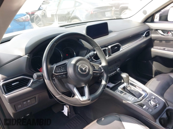 2020 Mazda CX-5 Grand Touring with VIN JM3KFADM3L1819939, listed as a IAAI auction lot 42749920 with 35,407 mi miles and . Bid and sale history available at DreamBid. Image 20.