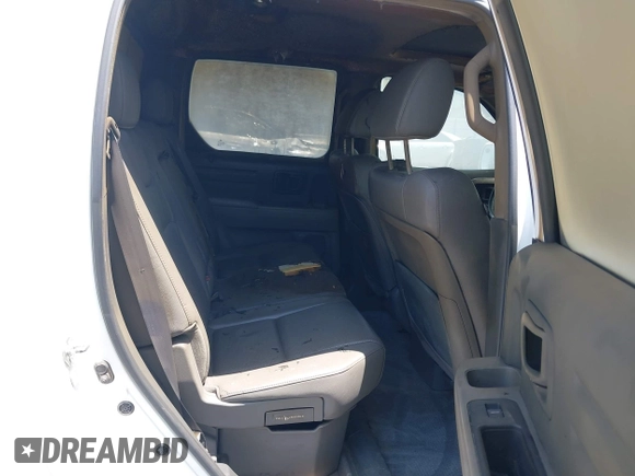 2013 Honda Ridgeline RTL with VIN 5FPYK1F50DB013612, listed as a IAAI auction lot 42430119 with 190,913 mi miles and . Bid and sale history available at DreamBid. Image 8.