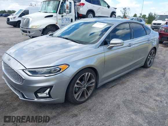 2020 Ford Fusion Titanium with VIN 3FA6P0D95LR199443, listed as a IAAI auction lot 42721371 with 77,592 mi miles and . Bid and sale history available at DreamBid. Image 19.