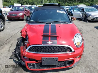2013 MINI Roadster S z VIN WMWSY3C58DT594039, wystawiony jako Copart lot #65833804 z przebiegiem Nie podano mil oraz Szkody całkowita. Historia ofert i sprzedaży dostępna na DreamBid. Obrazek 5.