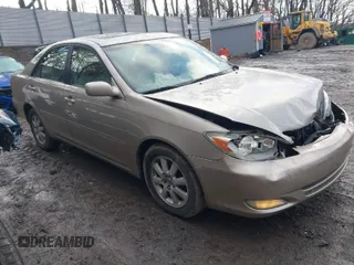 2003 Toyota Camry LE with VIN 4T1BE30K13U705105, listed as a IAAI auction lot 41696395 with 191,389 mi miles and . Bid and sale history available at DreamBid. Image 1.
