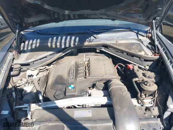 2011 BMW X5 35i with VIN 5UXZV4C58BL410570, listed as a IAAI auction lot 41886238 with 164,192 mi miles. Bid and sale history available at carsss.com. Image 10.