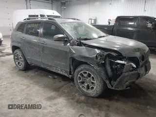 2021 Jeep Cherokee Trailhawk z VIN 1C4PJMBX4MD148597, wystawiony jako IAAI lot #41622099 z przebiegiem 48 452 mil mil oraz . Historia ofert i sprzedaży dostępna na DreamBid. Obrazek 1.