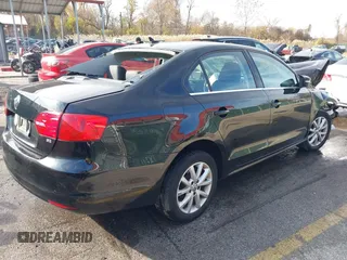 2014 Volkswagen Jetta Sedan SE w/Connectivity/Sunroof PZEV with VIN 3VWD17AJ5EM422359, listed as a IAAI auction lot 38090147 with 51,234 mi miles. Bid and sale history available at carsss.com. Image 4.