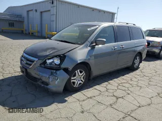 2007 Honda Odyssey EX-L z VIN 5FNRL38677B424117, wystawiony jako Copart lot #58814235 z przebiegiem 188 908 mil mil oraz Szkoda całkowita • Salvage title. Historia ofert i sprzedaży dostępna na DreamBid. Obrazek 1.