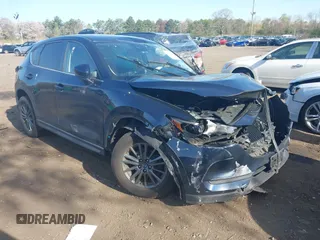 2019 Mazda CX-5 Touring with VIN JM3KFBCM6K0513037, listed as a IAAI auction lot 42121789 with 59,455 mi miles and . Bid and sale history available at carsss.com. Image 1.
