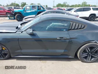 2016 Ford Mustang EcoBoost z VIN 1FA6P8TH0G5289907, wystawiony jako IAAI lot #42057565 z przebiegiem 129 917 mil mil oraz . Historia ofert i sprzedaży dostępna na DreamBid. Obrazek 14.