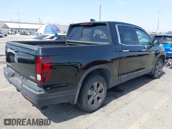 2020 Honda Ridgeline RTL-E with VIN 5FPYK3F70LB009376, listed as a IAAI auction lot 42488529 with 30,932 mi miles and . Bid and sale history available at DreamBid. Image 4.