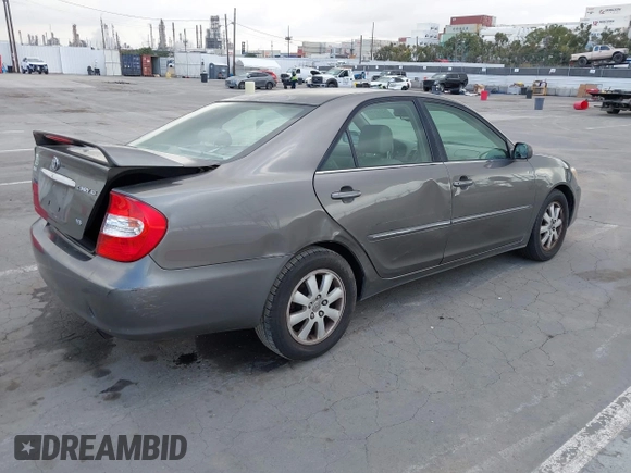 2004 Toyota Camry LE with VIN 4T1BF32K84U588764, listed as a IAAI auction lot 42126345 with 144,642 mi miles. Bid and sale history available at carsss.com. Image 4.