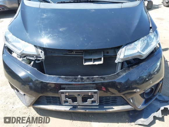 2015 Honda Fit EX-L z VIN 3HGGK5H85FM717646, wystawiony jako IAAI lot #42483387 z przebiegiem 137 296 mil mil oraz . Historia ofert i sprzedaży dostępna na DreamBid. Obrazek 16.
