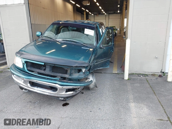 1997 Ford F-150 XL with VIN 1FTEX18L1VKB44867, listed as a IAAI auction lot 41266572 with 105,061 mi miles. Bid and sale history available at carsss.com. Image 17.