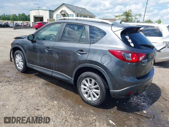 2015 Mazda CX-5 Touring with VIN JM3KE4CY9F0506879, listed as a IAAI auction lot 42209768 with 87,690 mi miles and . Bid and sale history available at DreamBid. Image 3.