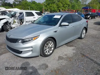 2018 Kia Optima EX with VIN 5XXGU4L34JG237557, listed as a IAAI auction lot 42000008 with 128,694 mi miles and . Bid and sale history available at carsss.com. Image 2.