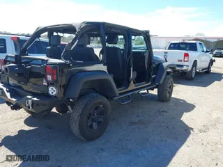 2010 Jeep Wrangler Unlimited Sport with VIN 1J4BA3H19AL229369, listed as a IAAI auction lot 41699172 with 125,021 mi miles. Bid and sale history available at carsss.com. Image 4.