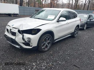 2018 BMW X1 xDrive28i with VIN WBXHT3C36J5L32162, listed as a IAAI auction lot 41802315 with 80,422 mi miles. Bid and sale history available at carsss.com. Image 2.