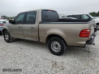 2001 Ford F-150 SuperCrew XLT with VIN 1FTRW07L21KF72022, listed as a Copart auction lot 69532204 with 205,793 mi miles and Salvage Title. Bid and sale history available at carsss.com. Image 2.