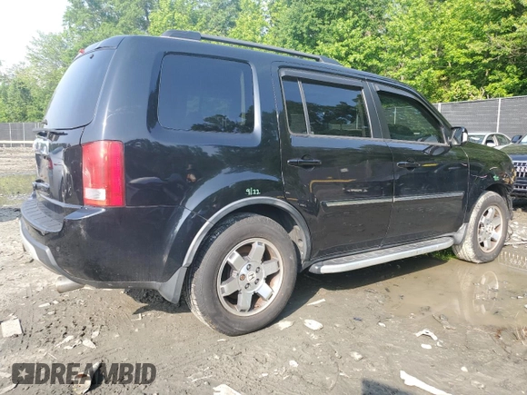 2011 Honda Pilot Touring z VIN 5FNYF4H92BB090512, wystawiony jako Copart lot #57046015 z przebiegiem 159 814 mil mil oraz Szkoda całkowita • Salvage title. Historia ofert i sprzedaży dostępna na DreamBid. Obrazek 3.
