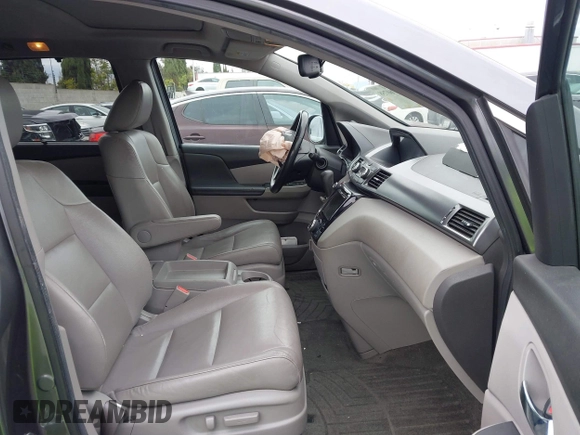 2014 Honda Odyssey EX-L with VIN 5FNRL5H64EB055807, listed as a IAAI auction lot 41760758 with 144,346 mi miles and . Bid and sale history available at carsss.com. Image 5.