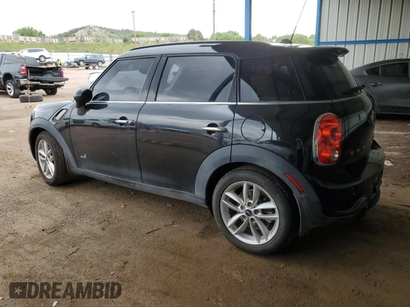 2014 MINI Countryman S with VIN WMWZC5C56EWP38065, listed as a Copart auction lot 59518395 with 91,106 mi miles and Salvage title. Bid and sale history available at DreamBid. Image 2.