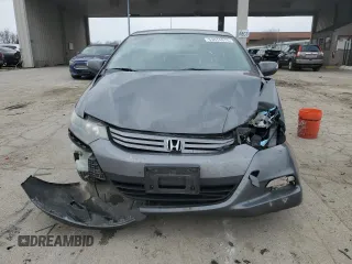 2011 Honda Insight EX z VIN JHMZE2H74BS005780, wystawiony jako Copart lot #53474975 z przebiegiem 326 780 mil mil oraz Szkoda całkowita • Salvage title. Historia ofert i sprzedaży dostępna na DreamBid. Obrazek 5.
