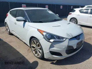 2013 Hyundai Veloster w/Black Int z VIN KMHTC6AD6DU107198, wystawiony jako IAAI lot #41983969 z przebiegiem 164 819 mil mil oraz . Historia ofert i sprzedaży dostępna na DreamBid. Obrazek 1.