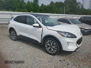 2020 Ford Escape Titanium z VIN 1FMCU9J9XLUB57675, wystawiony jako Copart lot #57777795 z przebiegiem Nie podano mil oraz Szkoda całkowita • Salvage title. Historia ofert i sprzedaży dostępna na DreamBid. Obrazek 4.