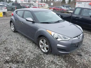 2012 Hyundai Veloster w/Gray Int z VIN KMHTC6AD7CU037130, wystawiony jako IAAI lot #41778588 z przebiegiem 125 549 mil mil oraz . Historia ofert i sprzedaży dostępna na DreamBid. Obrazek 1.