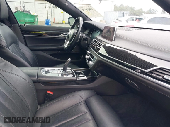 2019 BMW 7 Series 740i with VIN WBA7E2C57KB217973, listed as a IAAI auction lot 39064321 with 54,818 mi miles and . Bid and sale history available at DreamBid. Image 5.