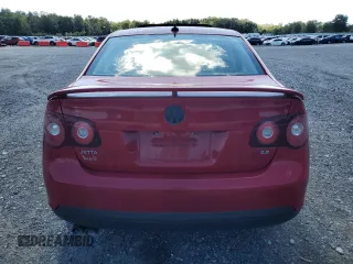 2009 Volkswagen Jetta SE with VIN 3VWRZ71K69M177746, listed as a Copart auction lot 70990074 with 128,390 mi miles and Salvage title. Bid and sale history available at DreamBid. Image 6.