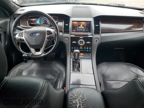 2013 Ford Taurus Limited z VIN 1FAHP2F81DG229944, wystawiony jako Copart lot #63218315 z przebiegiem 199 897 mil mil oraz Czysty tytuł • Clean title. Historia ofert i sprzedaży dostępna na DreamBid. Obrazek 8.