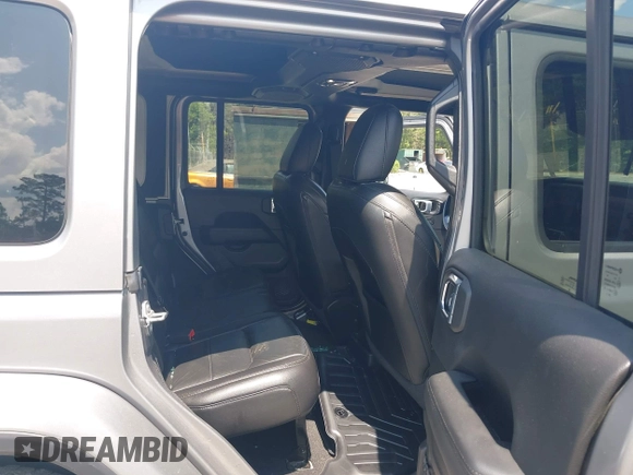 2021 Jeep Wrangler Unlimited Sahara with VIN 1C4HJXEN3MW628845, listed as a IAAI auction lot 42438049 with 49,970 mi miles and . Bid and sale history available at DreamBid. Image 8.