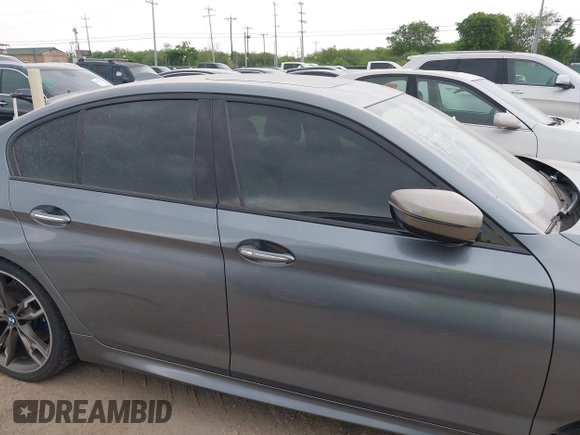 2018 BMW 5 Series M550i xDrive with VIN WBAJB9C55JB035694, listed as a IAAI auction lot 42122730 with 61,561 mi miles and . Bid and sale history available at DreamBid. Image 14.