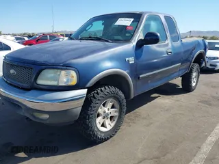 2003 Ford F-150 XL with VIN 1FTRX18WX3NA22323, listed as a IAAI auction lot 41635869 with 129,029 mi miles. Bid and sale history available at carsss.com. Image 2.