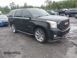 2015 GMC Yukon SLT z VIN 1GKS1BKC5FR119566, wystawiony jako IAAI lot #42376879 z przebiegiem 215 010 mil mil oraz . Historia ofert i sprzedaży dostępna na DreamBid. Obrazek 1.