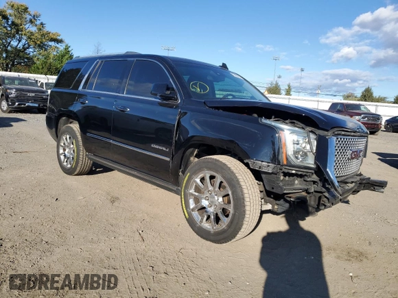 2016 GMC Yukon Denali with VIN 1GKS1CKJXGR329103, listed as a Copart auction lot 75492494 with 124,374 mi miles and Salvage Title. Bid and sale history available at carsss.com. Image 4.