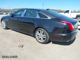 2018 Jaguar XJ with VIN SAJWJ2GD2J8W13463, listed as a IAAI auction lot 41897451 with 70,448 mi miles. Bid and sale history available at carsss.com. Image 3.