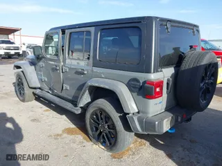 2023 Jeep Wrangler 4xe Sahara with VIN 1C4JJXP68PW661190, listed as a IAAI auction lot 41816483 with 41,877 mi miles. Bid and sale history available at carsss.com. Image 3.