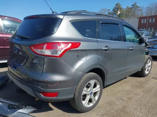 2013 Ford Escape SE with VIN 1FMCU9G94DUC98363, listed as a IAAI auction lot 41752773 with 150,547 mi miles and . Bid and sale history available at DreamBid. Image 4.
